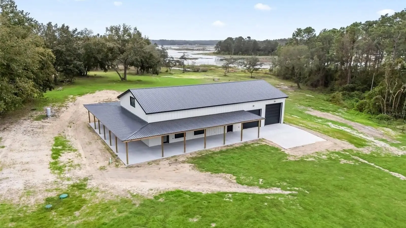 Aerial view of a metal-roofed barn on pasture in Marion County, FL